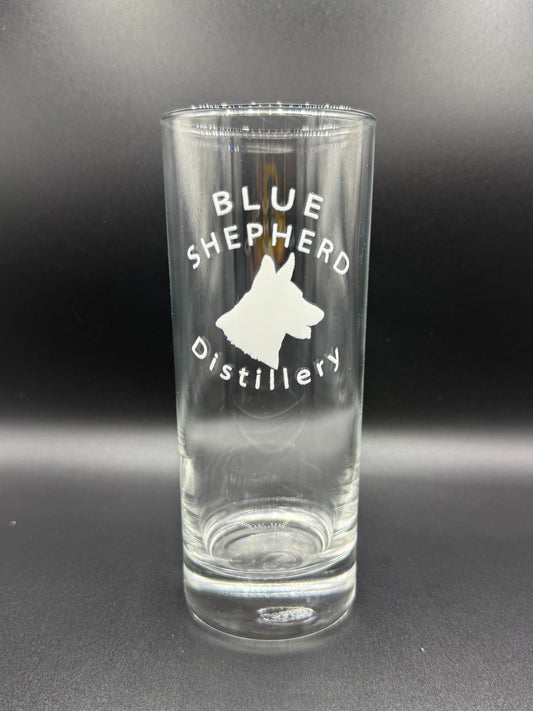 Clear glass bottle with 'Blue Shepherd Distillery' branding on a dark background